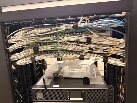 Network rack with patch cabling and UPS